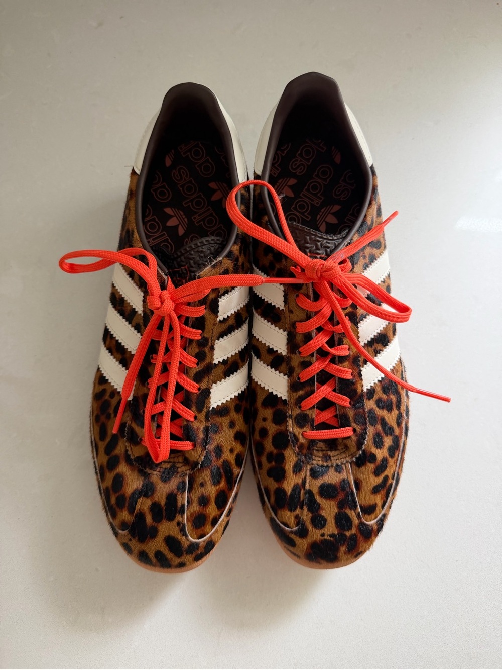 Adidas Women’s Leopard-Print sambas with White Stripes and Orange Laces